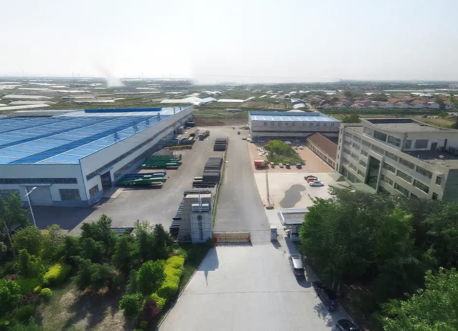 Wide aerial view of the Bailing Wooden plant, warehouse and loading area